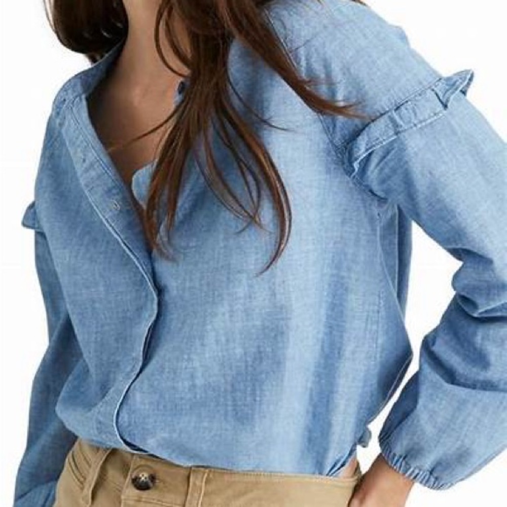 Madewell light denim blouse with ruffled sleeves.